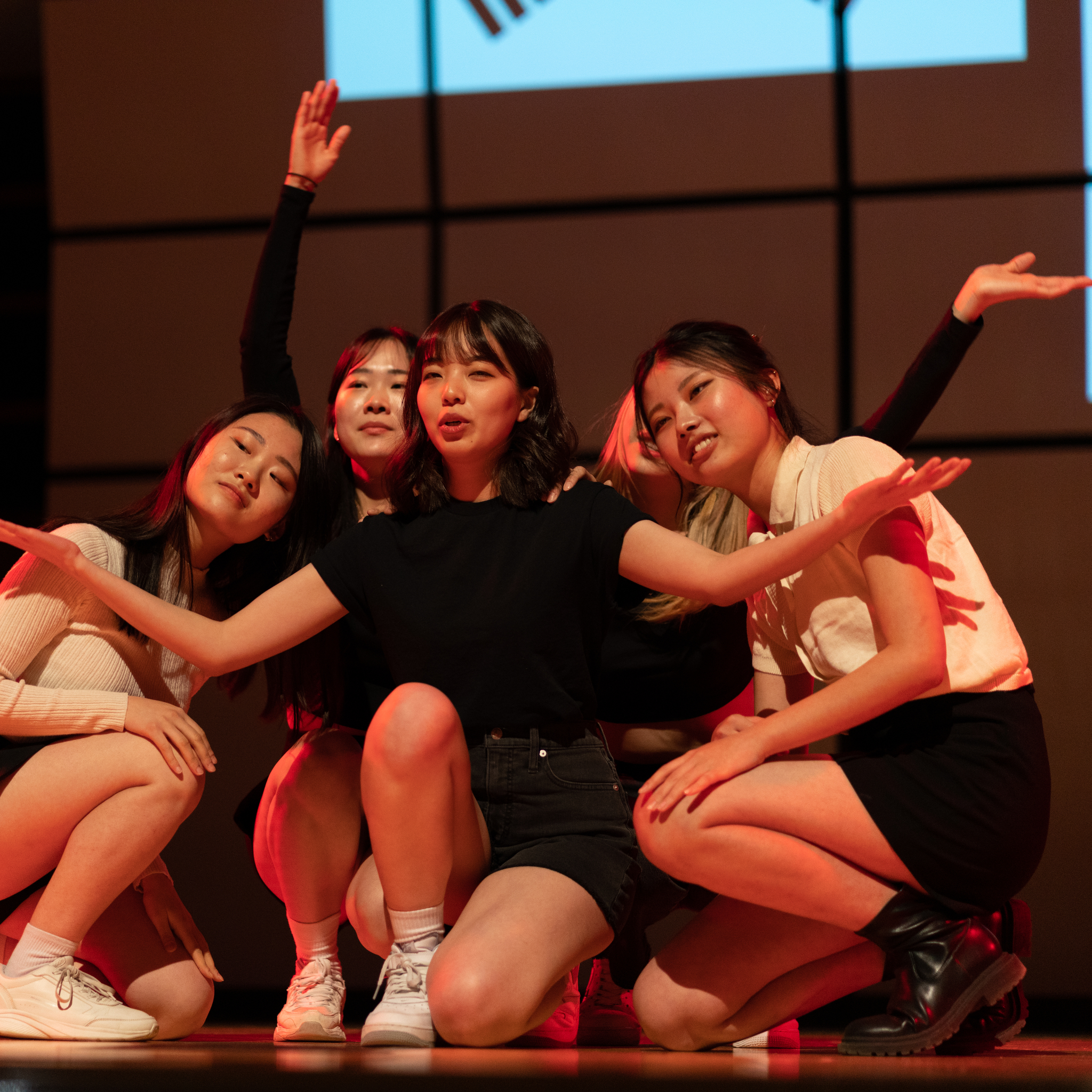 Students Crouched In A Pose